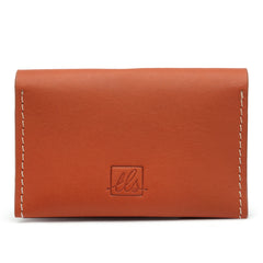 A closed toffe bi-fold credit card holder with visible stitching and a embossed logo on the front of the leather story