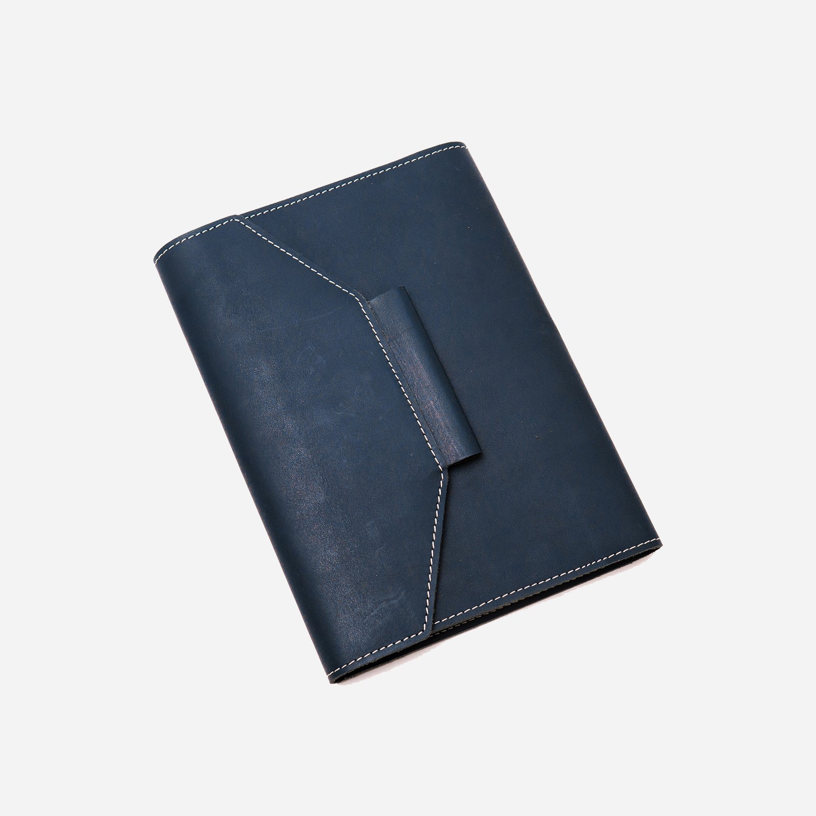 A navy blue leather notebook  organiser with a pen slider, closed with a regular book binding. The notebook appears to have a solid, smooth finish.