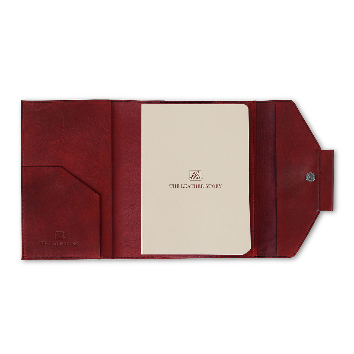 A red leather notebook organiser  with a pen slider, closed with a regular book binding. The notebook appears to have a solid, smooth finish.