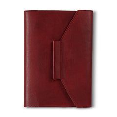 A red leather notebook  organiser with a pen slider, closed with a regular book binding. The notebook appears to have a solid, smooth finish.