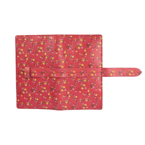 A red leather wallet with a floral pattern and a striped cotton lining visible from the open side.