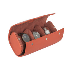 A tangerine leather watch roll box with microfibre interior, displaying watches through its open side.