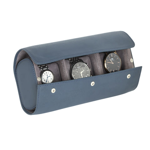 A nevy blue leather watch roll box with microfibre interior, displaying watches through its open side.