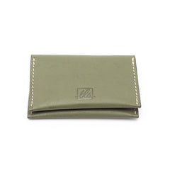 A closed olive green bi-fold credit card holder with visible stitching and a embossed logo on the front of the leather story