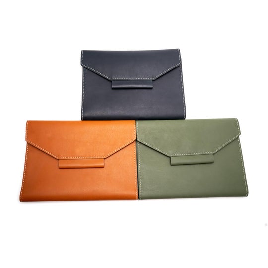 Trio of handcrafted leather notebook organiser in navy blue, tan brown, and olive green  elegant minimalist design by The Leather Story.

